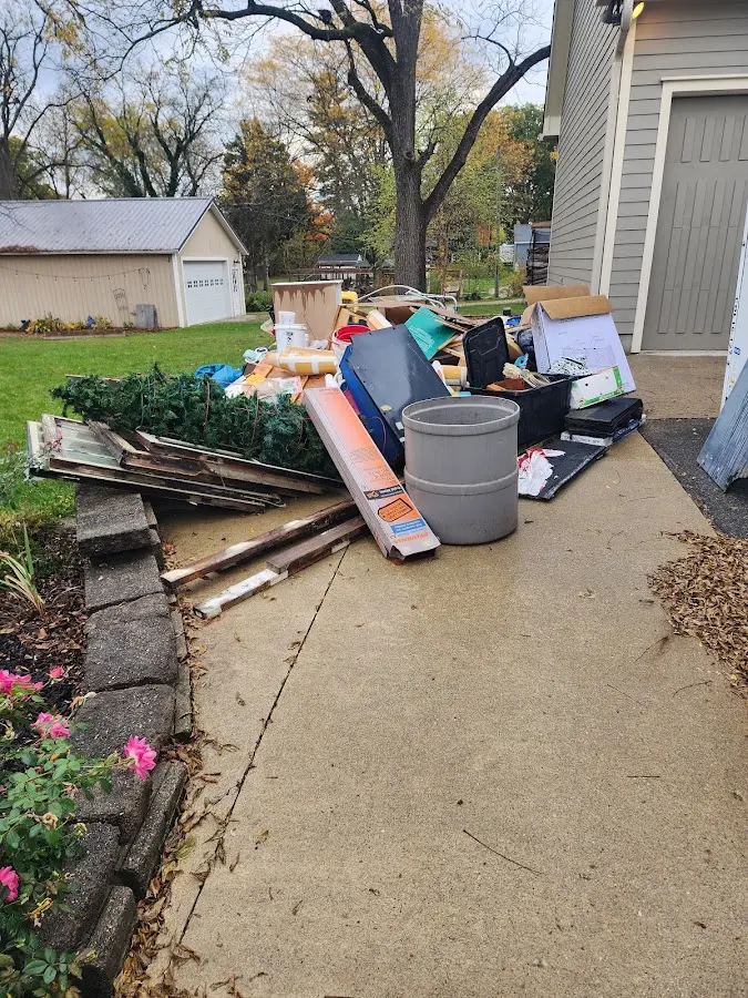 Dumpster being loaded with debris for 3 Yard Dumpster Rental in Duanesburg